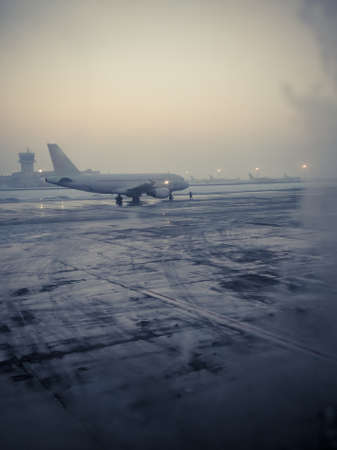 Color shot of a commercial airplane on the runaway, on a cold winter morning.のeditorial素材