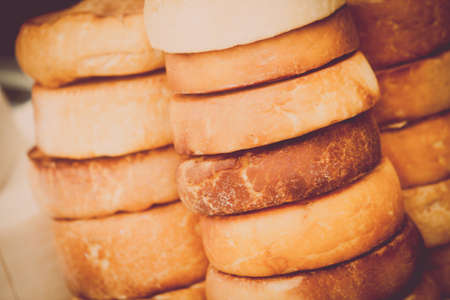 Close up shot of a pile of traditional home made round cheese.の写真素材