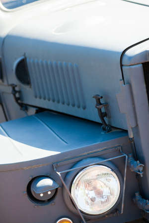 Color detail on the headlight of a vintage car.の写真素材