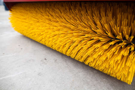 Close up shot of a road brush sweeping machine.の写真素材