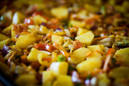 Close up shot of various baked vegetables.