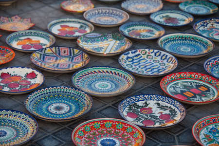 Color image of some handmade Uzbekistan plates for sale.