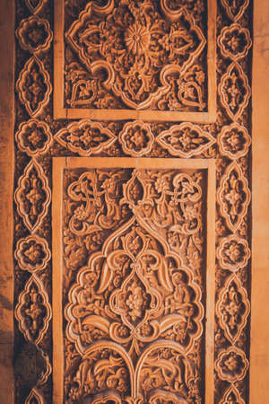 Arabic decorations close up on a wooden door.の写真素材