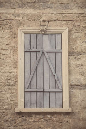 Close up shot of an old window closed with wood.の写真素材