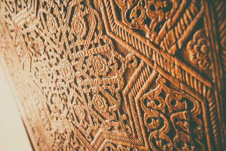 Arabic decorations close up on a wooden door.の写真素材