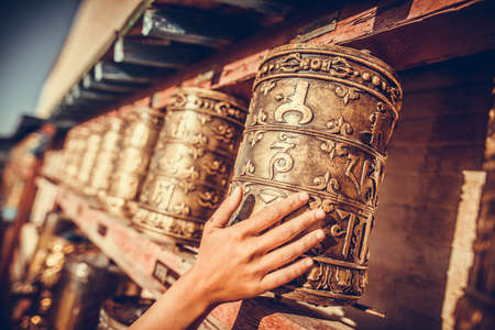Spinning Buddhist prayer drums at a monastery in Mongolia.の写真素材