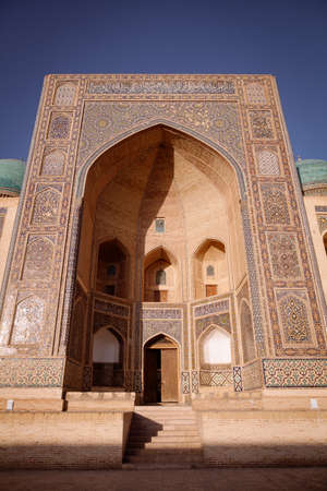 Color image with a madrasa entrance in Bukhara, Uzbekistan.