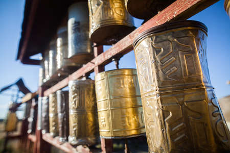 Spinning Buddhist prayer drums at a monastery in Mongolia.の写真素材
