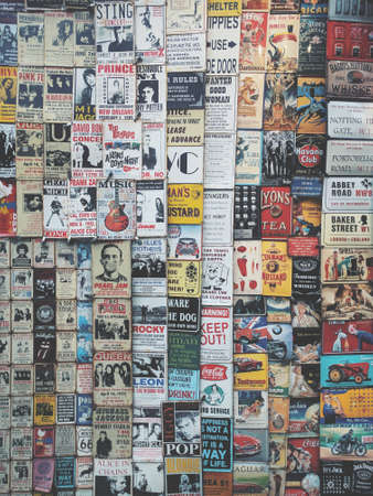 London, England - January 13, 2018: Color vintage tin adverts on a window shop in London, England.のeditorial素材