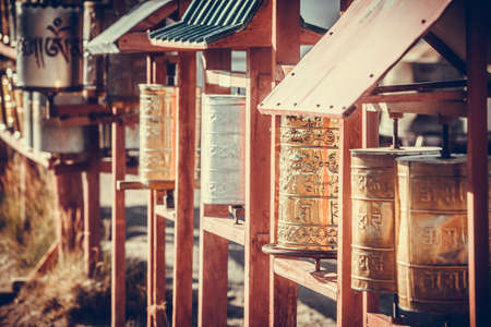 Spinning Buddhist prayer drums at a monastery in Mongolia.の写真素材