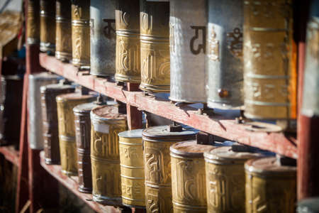 Spinning Buddhist prayer drums at a monastery in Mongolia.の写真素材