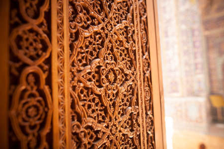 Arabic decorations close up on a wooden door.の写真素材