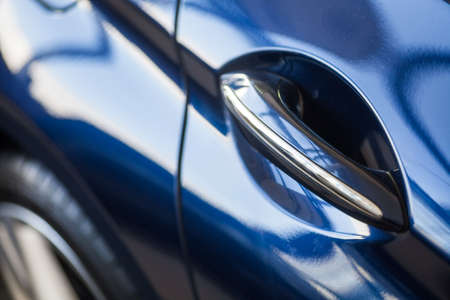 Close up shot of a car door handle.