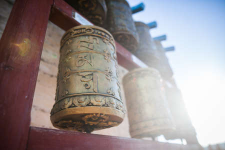 Spinning Buddhist prayer drums at a monastery in Mongolia.の写真素材