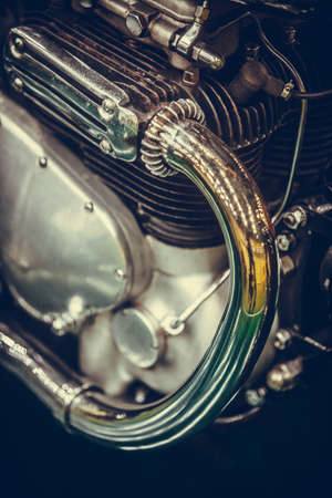 Close up of a vintage motorcycle exhaust pipe and cylinder.の写真素材