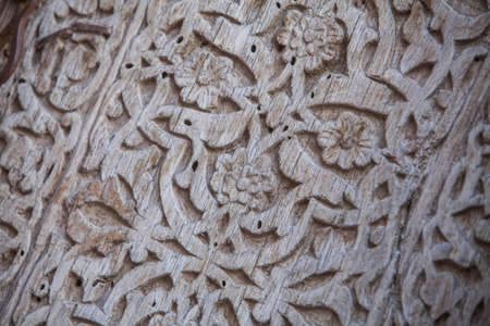 Arabic decorations close up on a wooden door.の写真素材