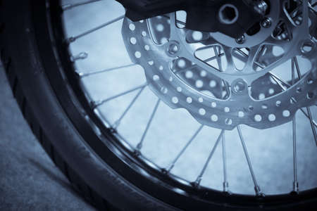 Close up shot of a motorcycle double disk front brake.