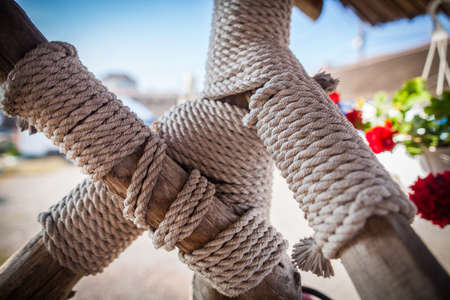 Color image of some wooden poles tied with rope.の写真素材