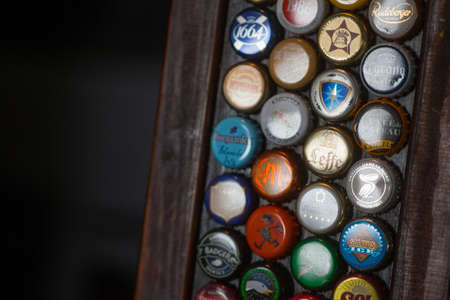 Bucharest, Romania - May 8, 2018: Illustrative editorial image of some branded beer bottle caps displayed on a wall in Bucharest, Romania.のeditorial素材