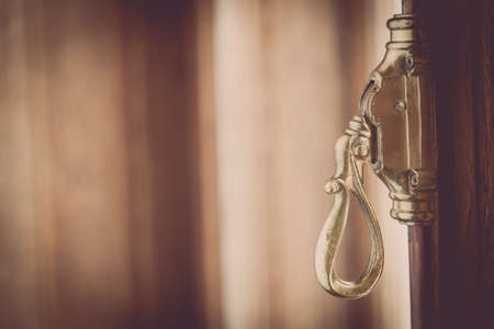Close up shot of a vintage metal window lever.の写真素材