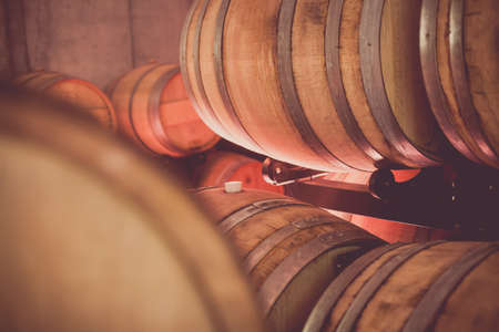 Close up shot of some wine barrels in a cellar.の写真素材