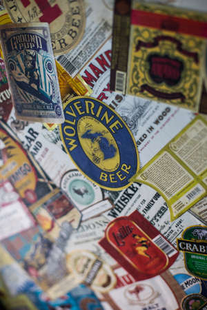 Bucharest, Romania - July 29, 2018: Illustrative-editorial image of various alcohol labels are displayed on a wall in a pub in Bucharest, Romania.のeditorial素材