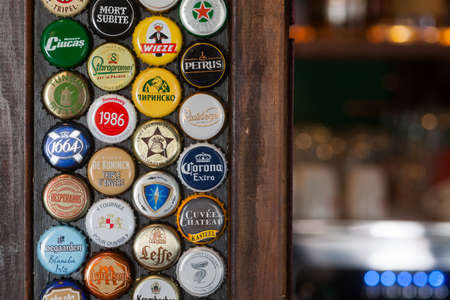 Bucharest, Romania - May 8, 2018: Illustrative editorial image of some branded beer bottle caps displayed on a wall in Bucharest, Romania.のeditorial素材