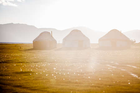 Evening shot of some yurts on a meadow in Kyrgyzstan.