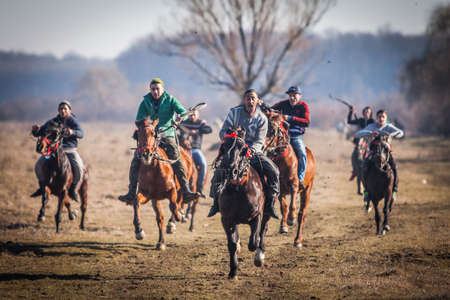 Pietrosani, Romania - January 6, 2018: People race their horses on Epiphany day celebrations in Pietrosani, Romania.のeditorial素材