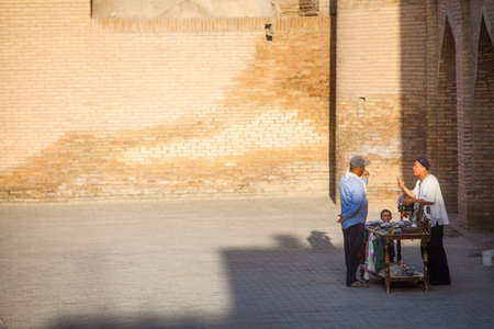 June 2, 2017 - Bukhara, Uzbekistan: Elderly people chat on the historical district of Bukhara, Uzbekistan.のeditorial素材