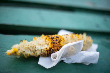 Close up shot of a half eaten roasted corn.の写真素材