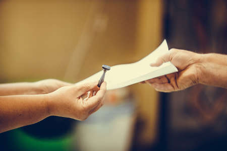 Person receives the stamp at a polling station, during elections.の写真素材