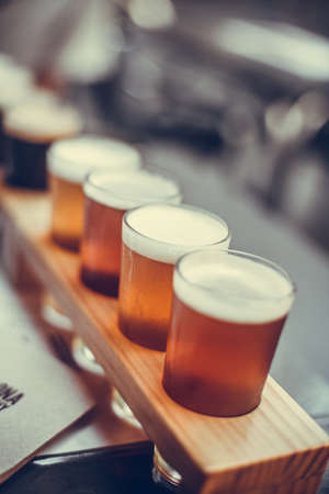 Selection of beers on a tasting mat.の写真素材