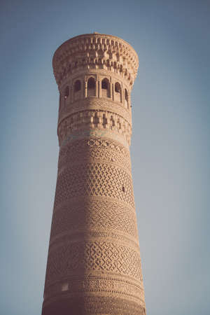 Color image with some madrasa tower in Khiva, Uzbekistan.の写真素材