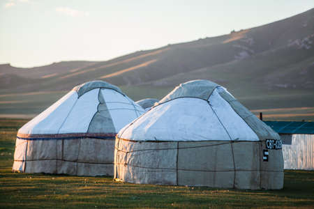 Evening shot of some yurts on a meadow in Kyrgyzstan.