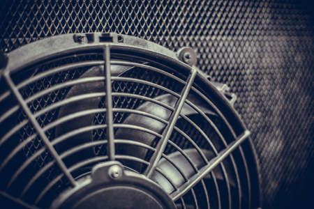 Close up image of the engine cooling fan of a bus.