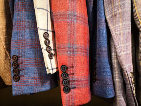 Close up shot of some coats sleeves in a shop.の写真素材