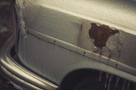 Color detail of some rust on an old car, and icicles.の写真素材