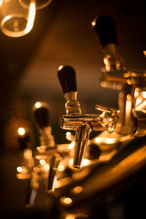 Close up of a beer dispenser in a pub.の写真素材