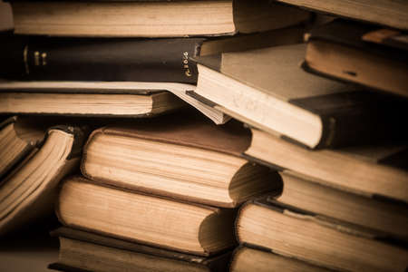 Color image of a pile of old books.