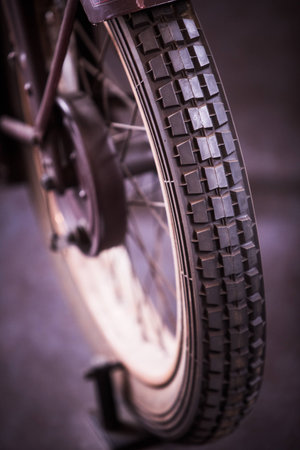 Color image of a vintage motorcycle wheel.