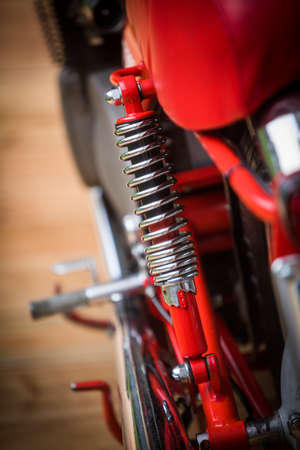 Color image of a red vintage motorcycle shock absorber.の写真素材