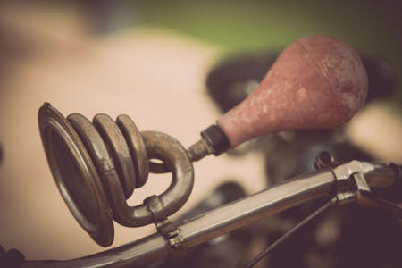 Color close up horizontal shot of a vintage motorcycle horn.
