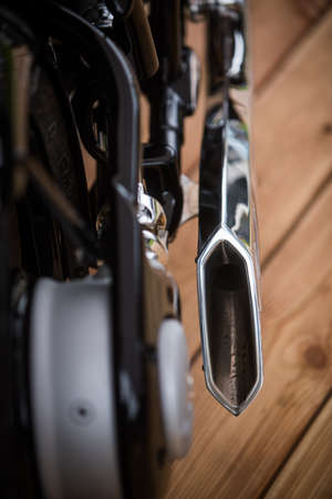 Close up of a vintage motorcycle exhaust pipe.
