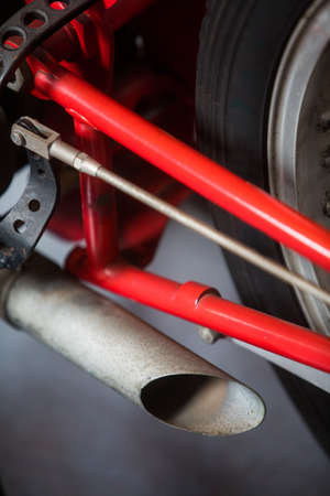 Close up of a vintage motorcycle exhaust pipe.