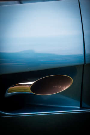 Close up vertical shot of a blue car exhaust pipe.の写真素材