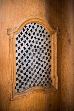 Image of a old wooden confessional in a church.の写真素材