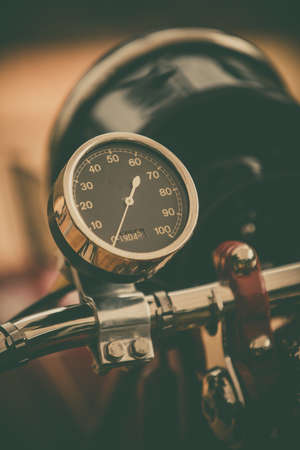 Close up vertical image of the speedometer gauge of a vintage motorcycle.の写真素材