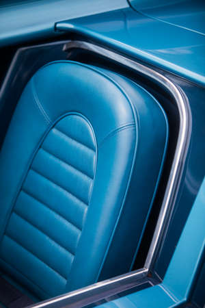 Color detail of the blue leather seats of a vintage car.の写真素材