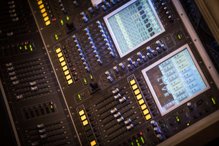 Close up shot of a sound equalizer in a music studio.